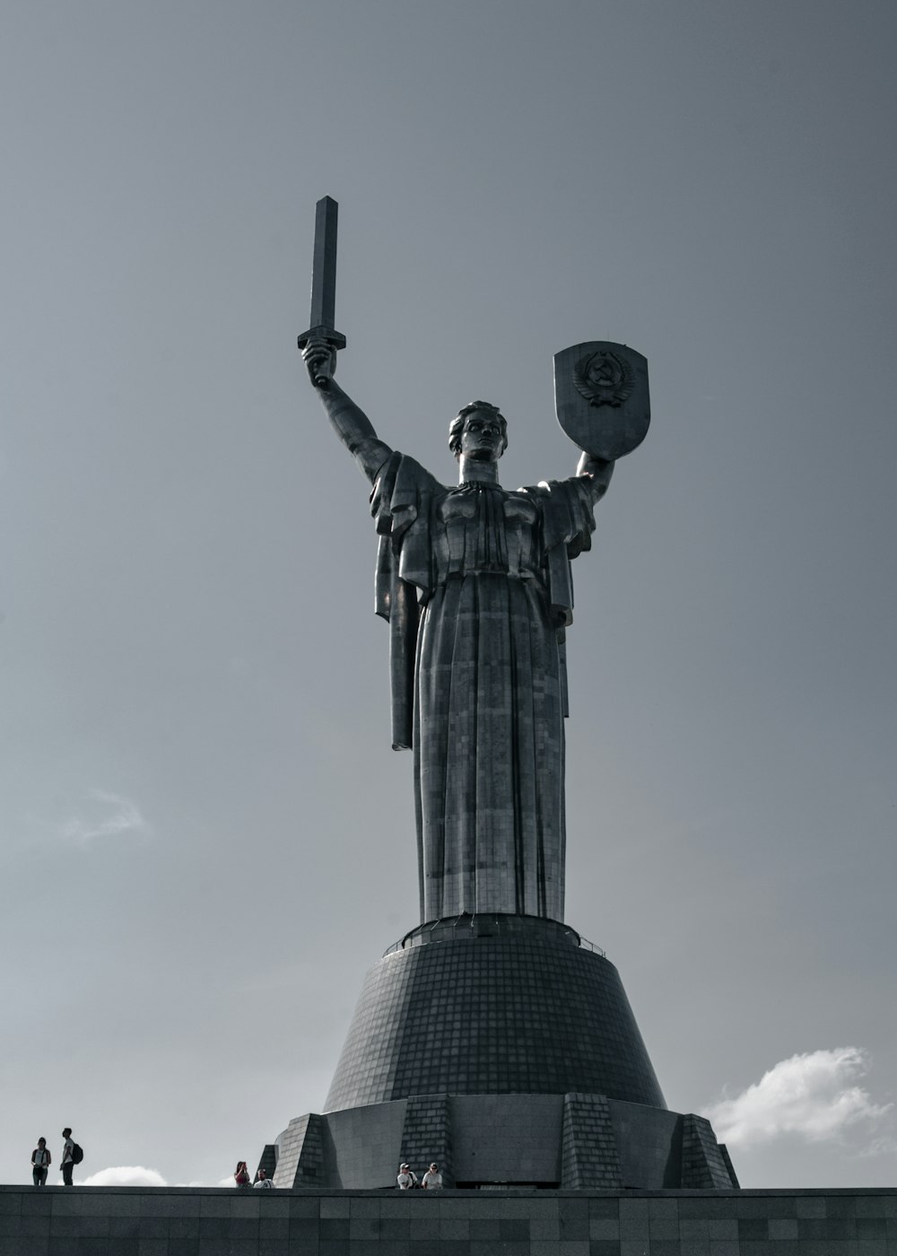 a statue of a woman holding a shield and a sword