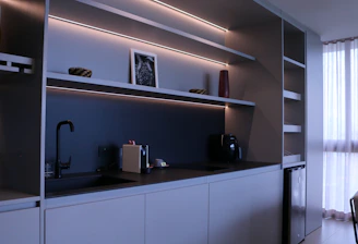 Custom modern kitchen cabinets in a bright, stylish Brazilian home setting.