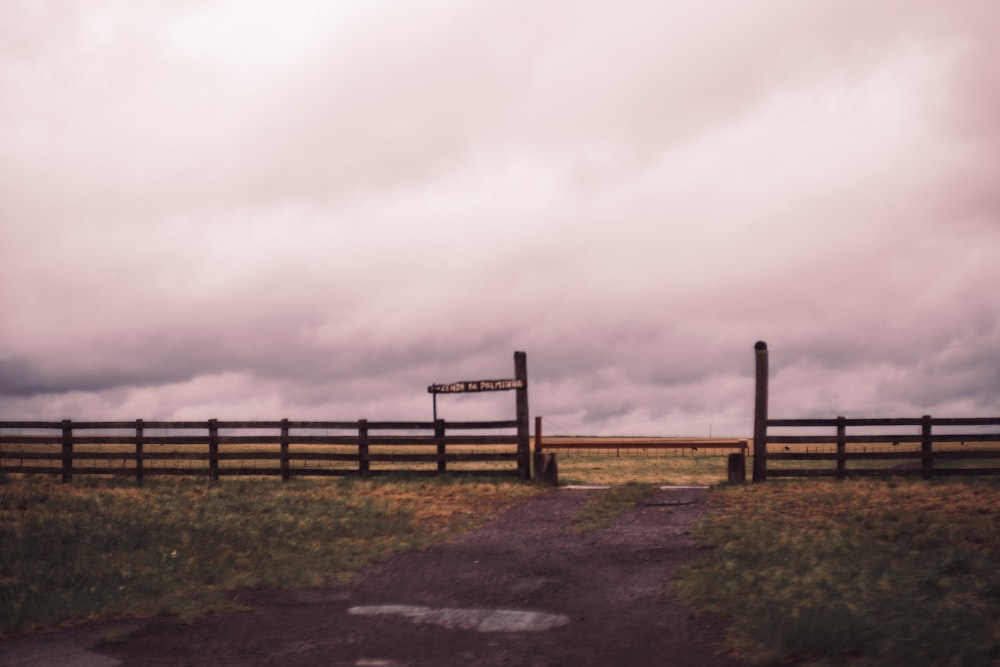 a wooden fence with a sign on it