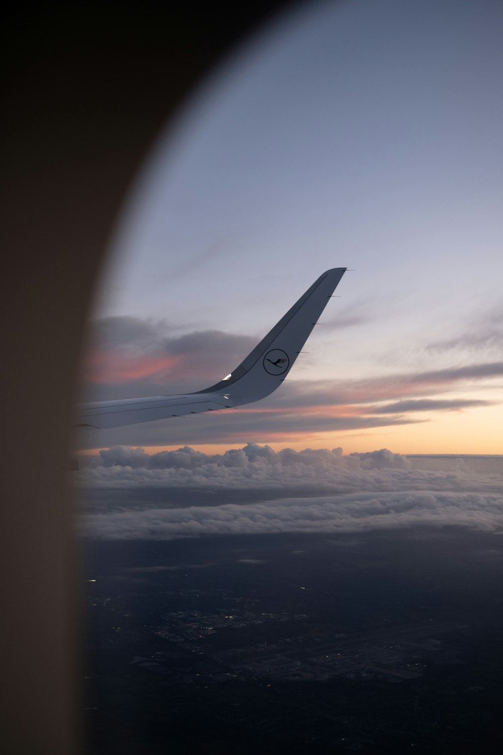 a view of the wing of an airplane in the sky