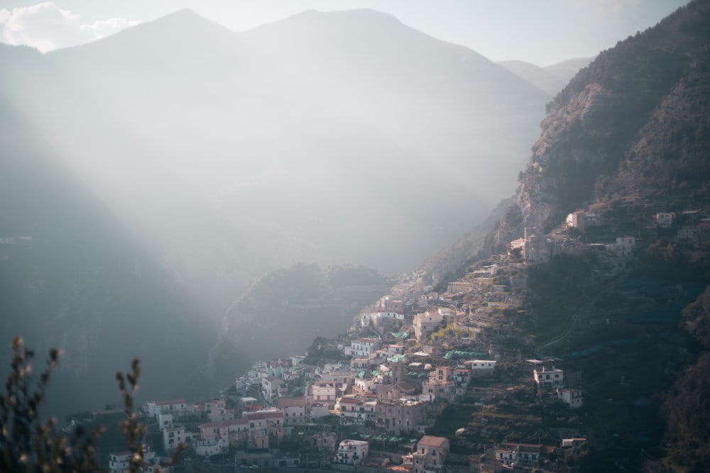 a view of a village in the mountains