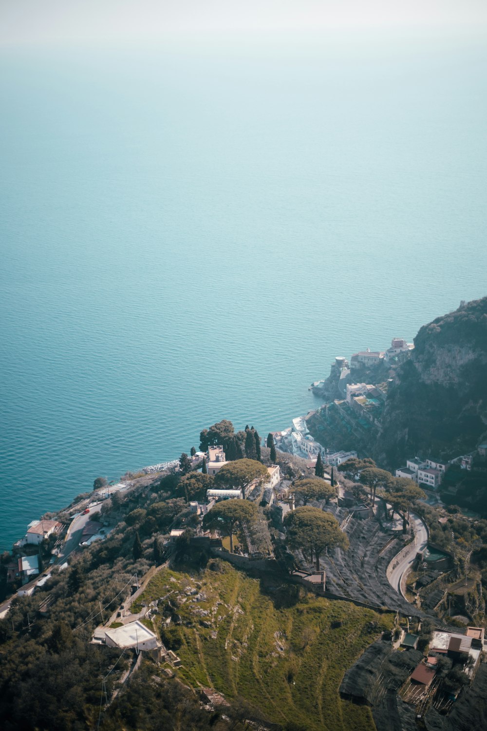 a scenic view of the ocean from a hill