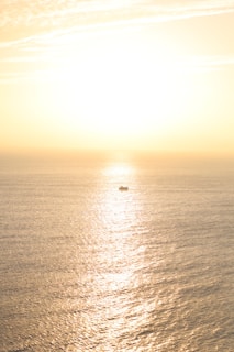 A serene ocean view from a boat during golden hour, capturing the peaceful vibe of Bali's waters.