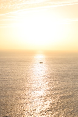 A serene ocean view from a boat during golden hour, capturing the peaceful vibe of Bali's waters.