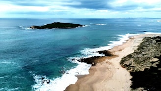 an aerial view of a beach and a body of water