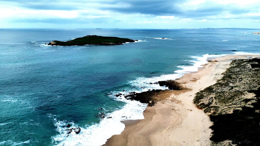 an aerial view of a beach and a body of water