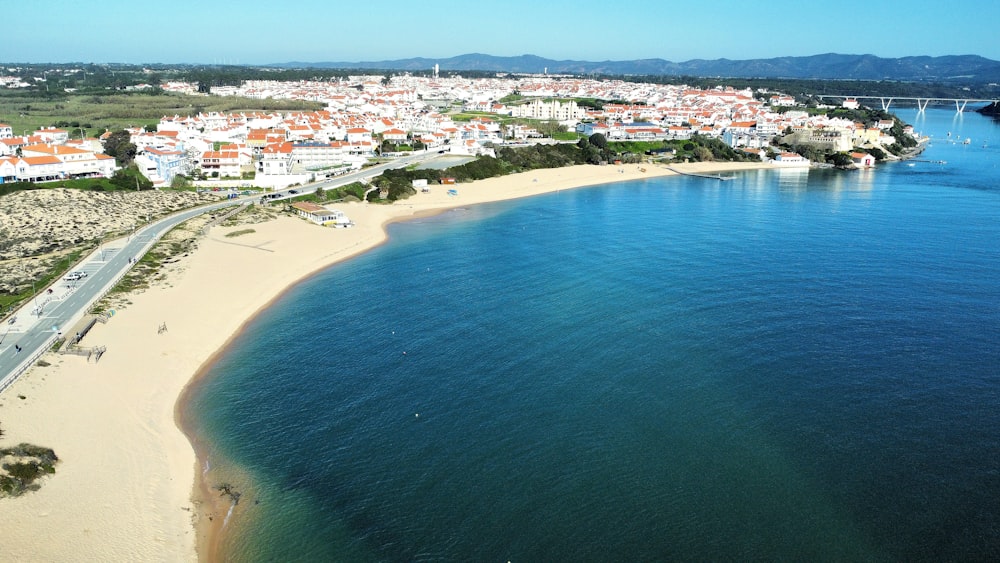 an aerial view of a beach and a city