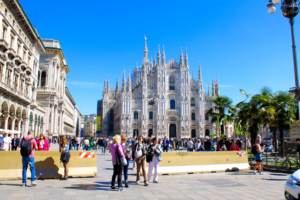 a group of people standing in front of a building