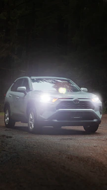 a car driving down a road at night