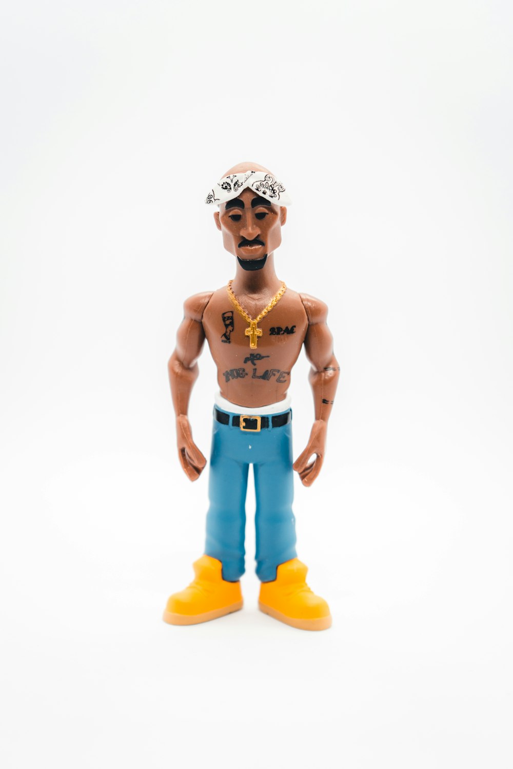 a toy figure of a man with tattoos on his chest