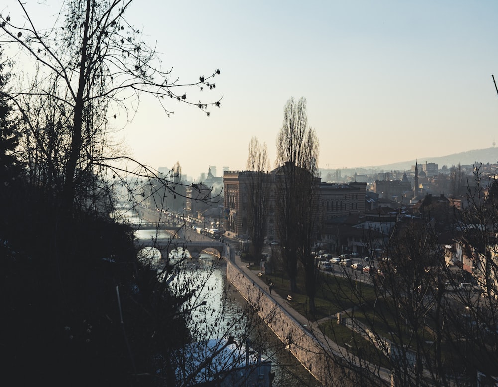 a river running through a city next to tall buildings