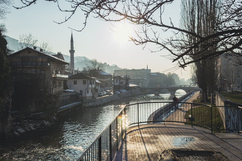 a river running through a city next to a bridge