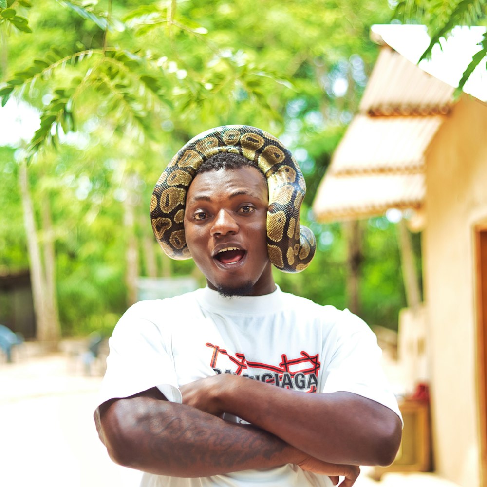 a man with a snake on his head