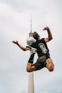 a man jumping in the air with a frisbee