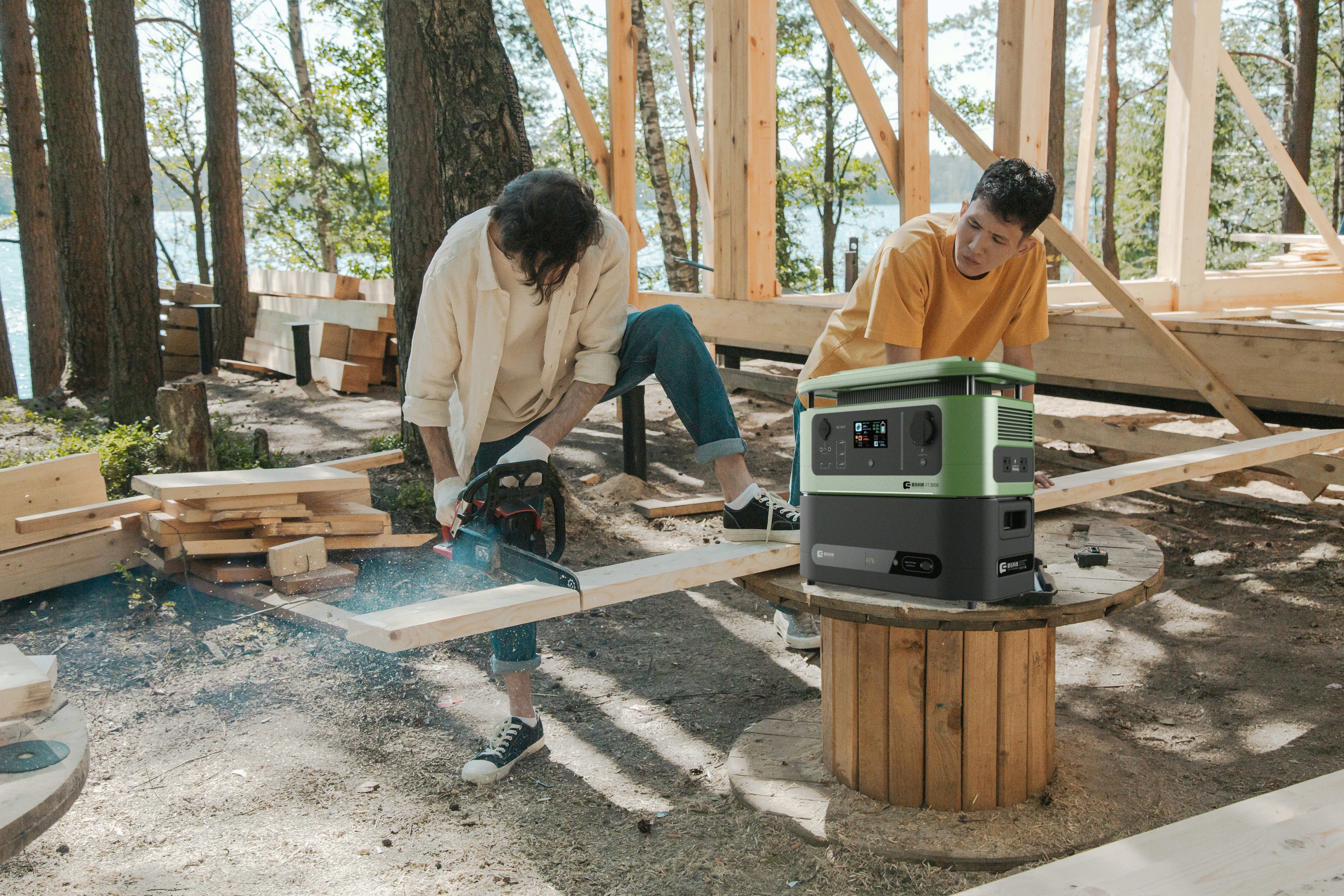 portable inverter generator running beside a camping tent at a lakeside campsite