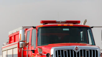 Modern firefighting truck and rescue ambulance ready for emergency response.