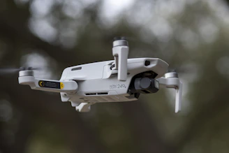 Close-up of a lightweight drone hovering indoors, navigating tight hallways with ease.