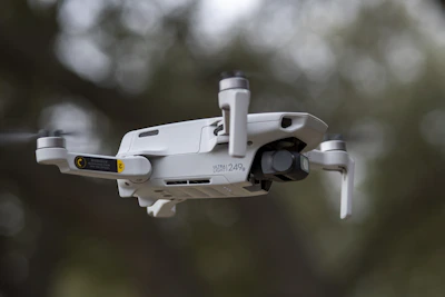 Close-up of a lightweight drone hovering indoors, navigating tight hallways with ease.