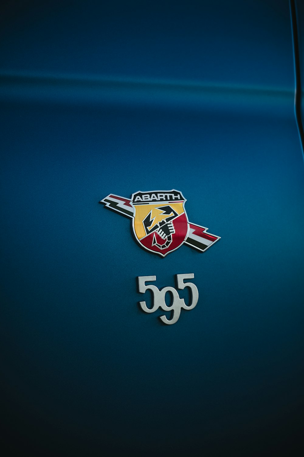 a close up of the emblem on a sports car