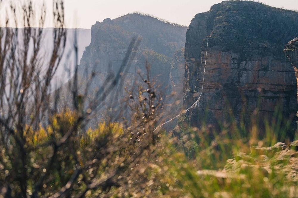 a view of a mountain with a cliff in the background