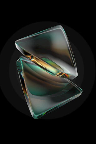 A sleek 3D golden geometric shape glowing softly against a deep black background with subtle glassmorphism effects.