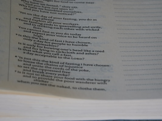 A close-up of a page from a book featuring a passage with text discussing fasting, humility, and justice.