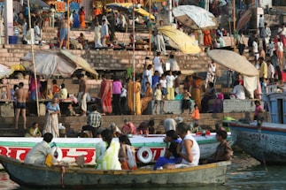 A warm community gathering by the river in Rohan, with traditional Breton boats and smiling locals.