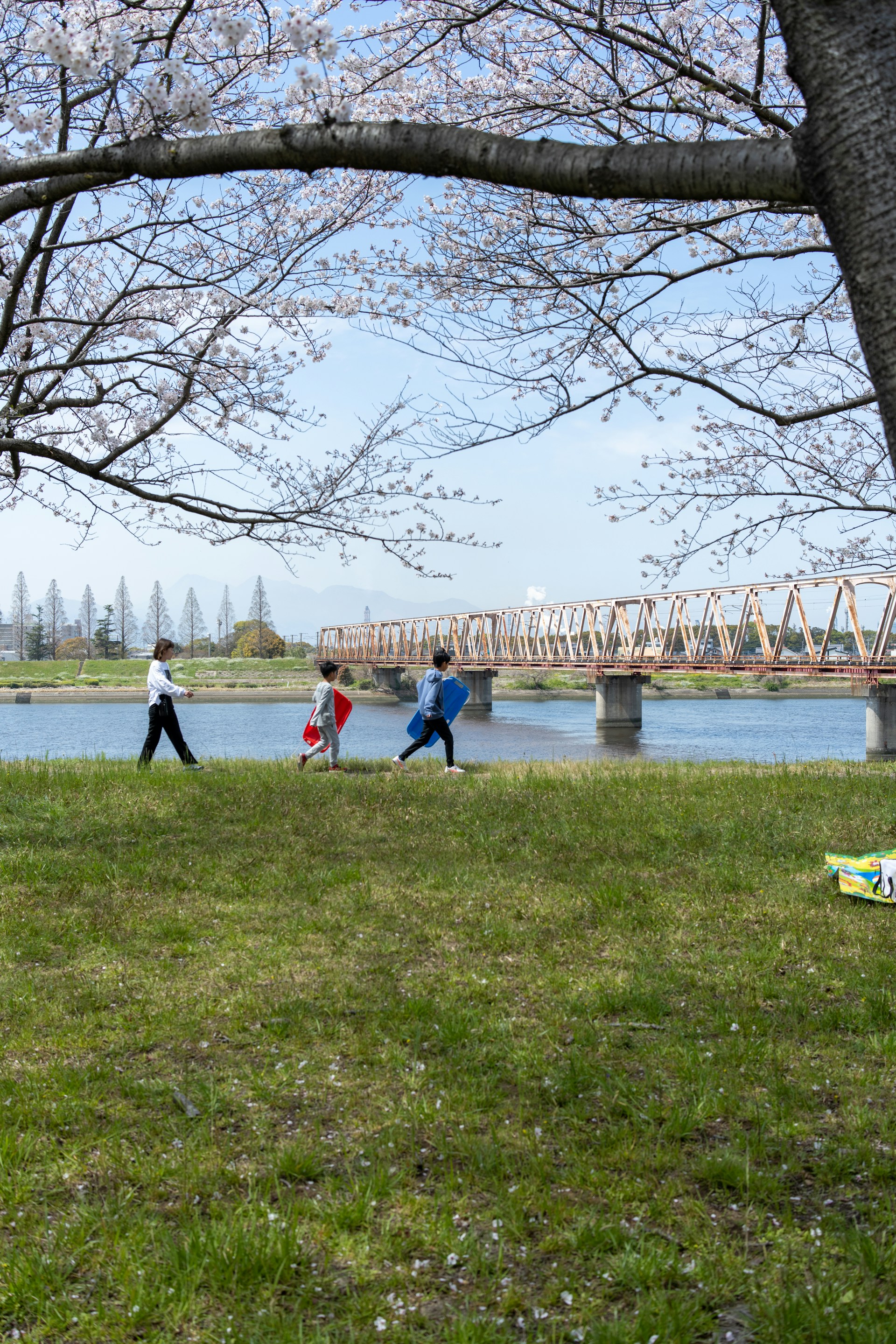 woman wearing yellow long-sleeved dress under white clouds and blue sky during daytime