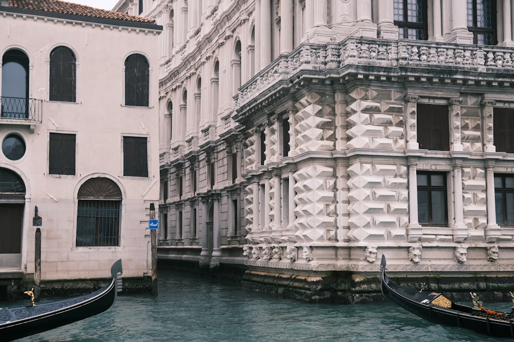 a couple of gondolas that are sitting in the water