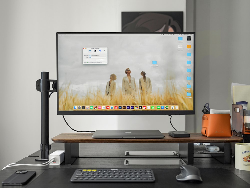 a computer monitor sitting on top of a desk