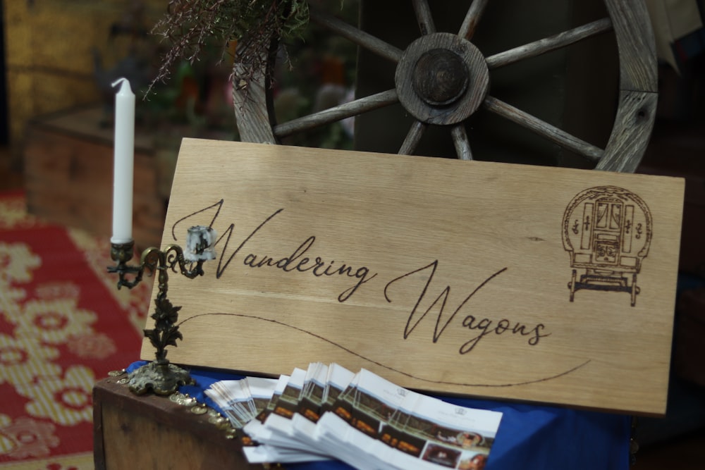 a wooden sign sitting on top of a table