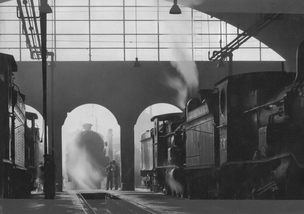 a black and white photo of a train station