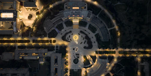 Evening view of a land development site with geometric layout and soft lighting.