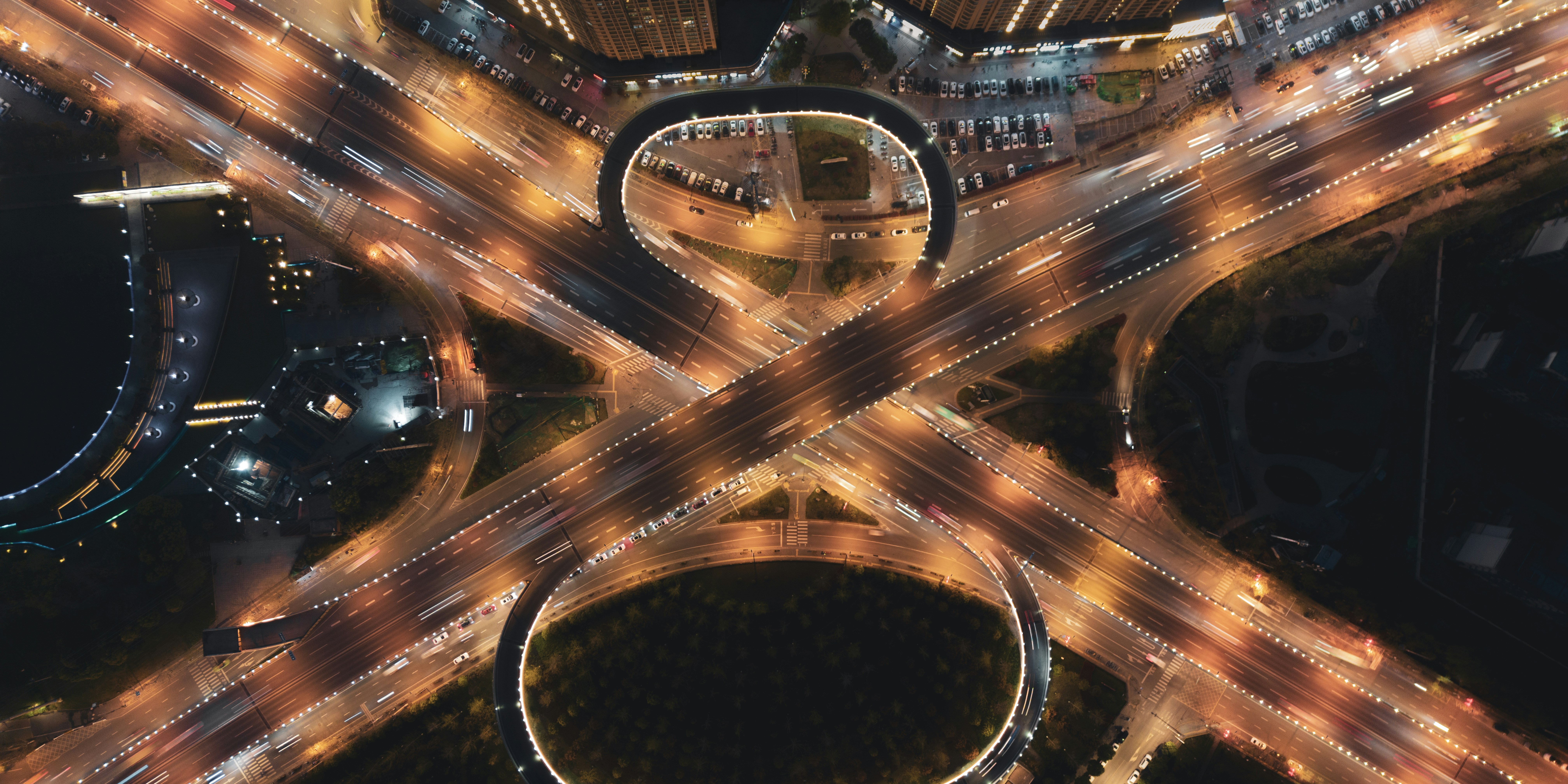 an aerial view of a city intersection at night