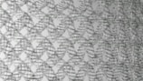 Interwoven metallic wireframes create a lattice-like pattern. The cables form a complex, repeating geometric structure, giving the impression of a mesh or net. The overall design is symmetrical and organized, producing a three-dimensional visual effect.