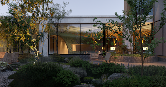 A modern architectural setting with large glass windows reflecting a softly lit interior. The foreground features a lush garden with various trees, shrubs, and rocks. There's a patio area with comfortable seating next to a small water feature, creating a serene outdoor living space.