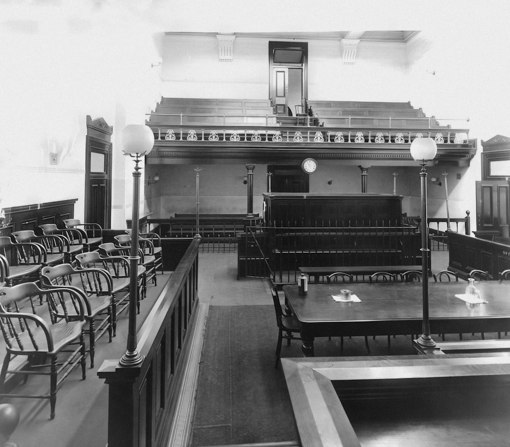 a black and white photo of a dining room