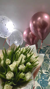 Sophisticated balloon bouquet set against a wedding backdrop.