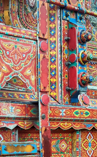 A colorful display of custom truck tarps showcasing various designs.