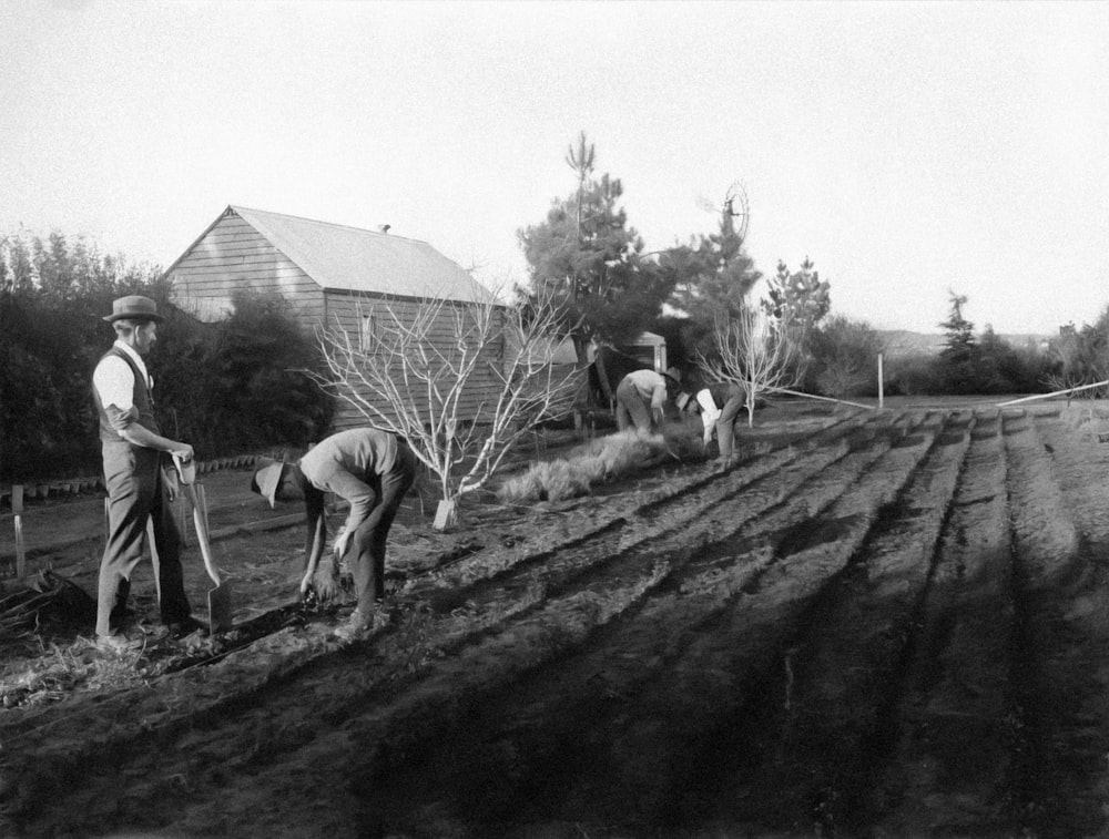 a couple of men that are standing in the dirt