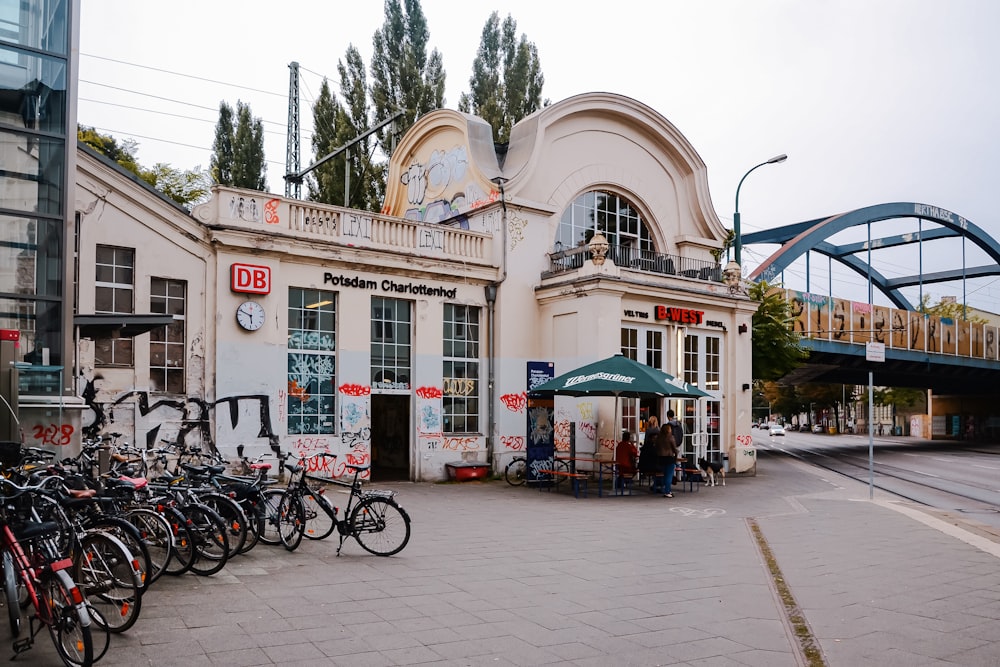 a group of bikes parked in front of a building