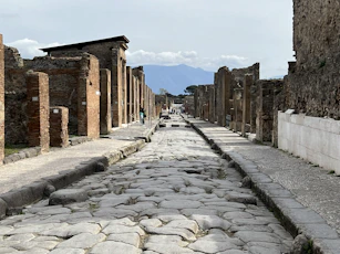 a cobblestone street lined with stone buildings