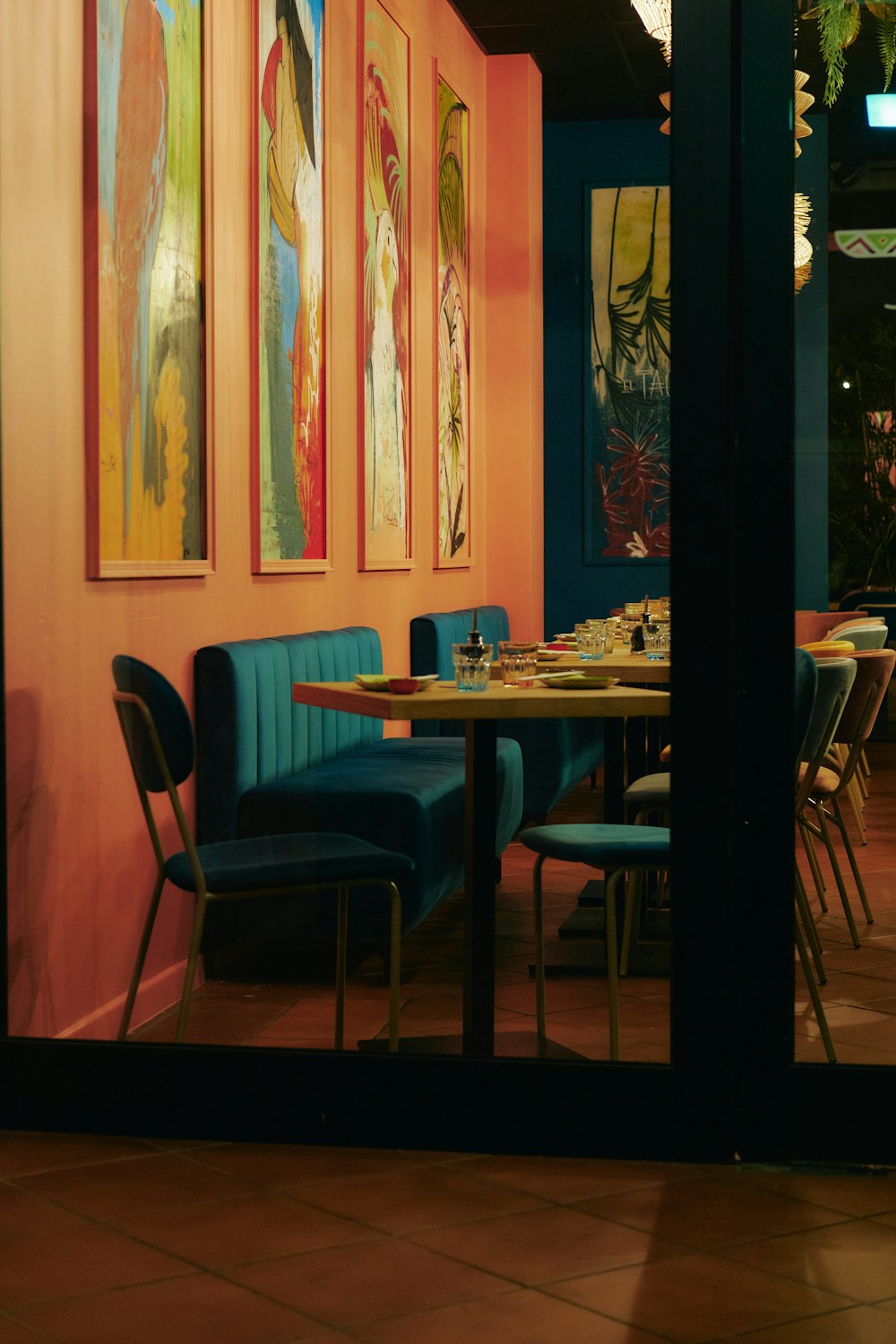 a dining room with a table and blue chairs