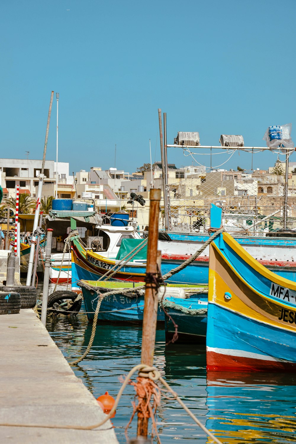 a group of boats that are sitting in the water