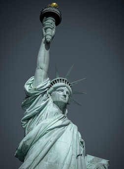 the statue of liberty is holding up the torch