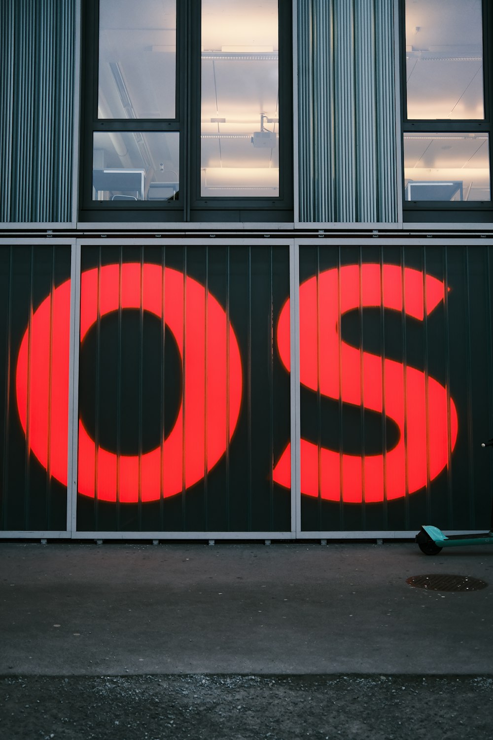 a red sign that is on the side of a building