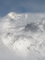 Snow-covered mountain landscape symbolizing preparation for ski season.