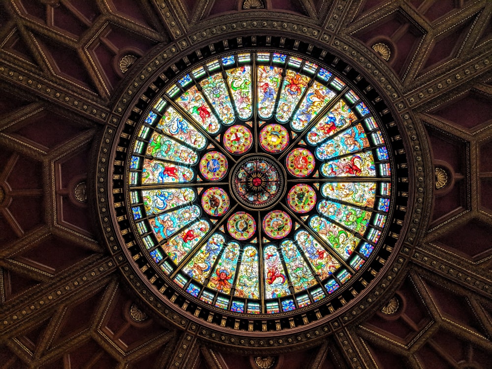 a large stained glass window in the ceiling of a building
