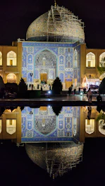 Before and after images of a mosque renovation showing fresh paint and restored architecture.