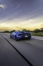 A dynamic view of a Renault car driving on an open road, symbolizing freedom and adventure.